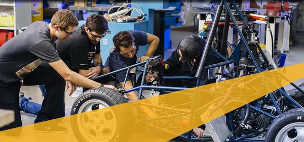 Students from the College of Engineering working on a K-cart